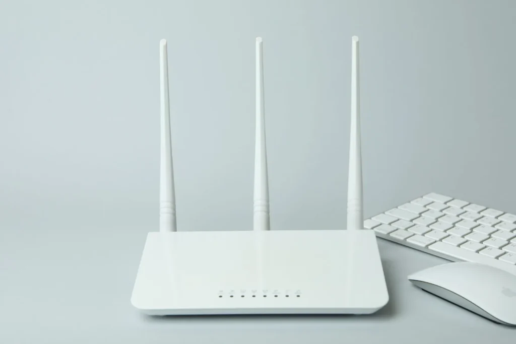 workplace with wi fi router on gray background 2023 11 27 05 20 18 utc scaled